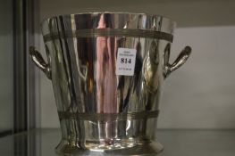 A Harrods silver plated wine bottle cooler.