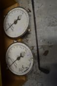 A pair of churn recorder scales and an old golf club.