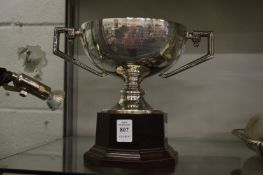 A silver twin handled trophy cup.