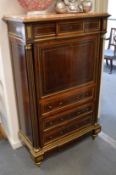 A good French Empire brass inlaid and mounted mahogany secretaire abattant with a frieze drawer,