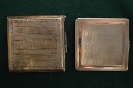 A silver and gold compact and a silver compact.