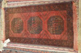 A small Persian bokhara rug, 101cm x 56cm together with nine modern machine made rugs.