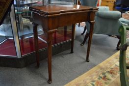 A good George II/III mahogany fold-over card table, the top of shaped rectangular form above a plain