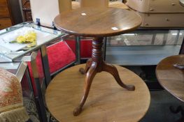 A 19th century mahogany low tripod table.