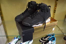 A pair of Air Jordan 6 retro DMP black metallic/gold black, size 10, boxed, appear unused.