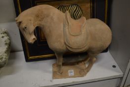 A Tang style terracotta horse and picture of a zebra, framed and glazed.
