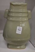 Chinese celadon glazed twin handle vase.