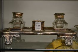 A plated desk stand.