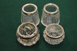 Two pairs of cut glass and silver salts.
