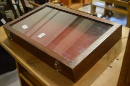 A small table top display case.