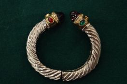 A decorative torque style bangle.