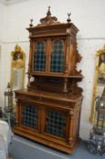 A highly impressive large Continental walnut standing cabinet in the Islamic taste, the upper