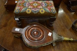 A pair of bellows and a foot stool.