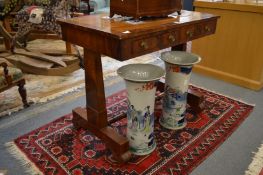 A 19th century mahogany two drawer side table with column supports united by a turned stretcher.