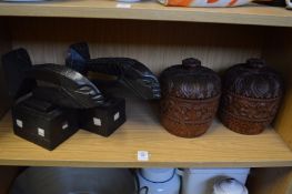 A pair of unusual carved wood book-ends and a pair of carved wood bowl and covers.
