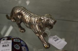A plated cast metal model of a tiger.