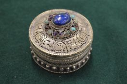 An Eastern white metal pill box.