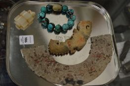 Two Chinese carved hard stone plaques, a bracelet and a pendant.