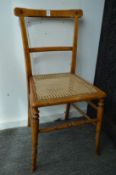 A pair of Victorian painted satin beech and cane work occasional chairs.