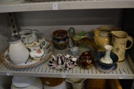 A shelf of decorative china.