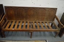 An 18th century oak panel back settle.