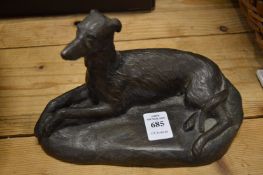 A bronzed model of a greyhound.
