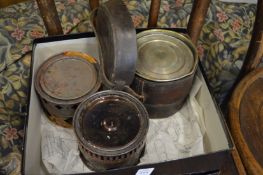 Three military camp stoves.