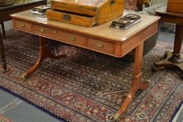 A good reproduction mahogany library or writing table with leather inset top, three frieze drawers