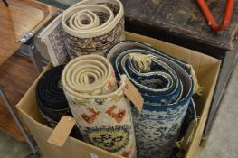 Four various machine made carpets and rugs.