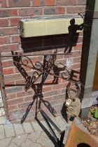 A golfing themed wrought iron weather vane.