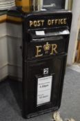 A reproduction cast iron post box.