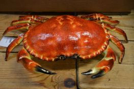 A cast iron box in the form of a crab.