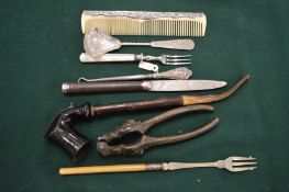 Nutcrackers, a pipe and other items.