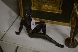 A small bronze seated female nude.