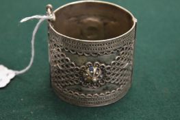 An Eastern white metal bangle.