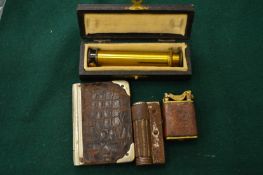 Cigarette lighter, small leather case etc.