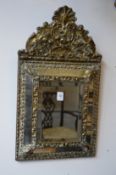 A pair of Victorian embossed brass Venetian style mirrors.