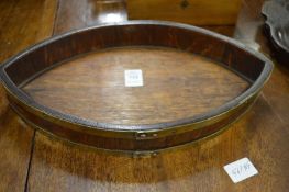 A brass bound oak navette shaped dish.