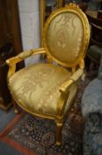 A pair of French style gilt wood armchairs.
