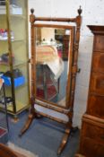 A 19th century mahogany cheval mirror.