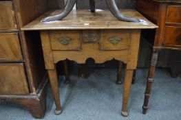 A 18th century oak low boy.