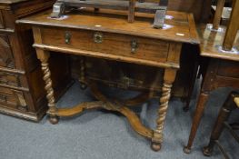 An 18th century oak single drawer side table with barley twist legs united by a flattened X shaped