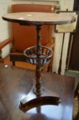 A 19th century rosewood circular occasional table with galleried under tier.