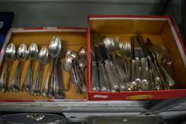 A twelve place canteen of cutlery, unboxed.