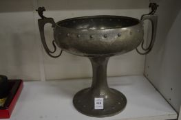 An Art Nouveau twin handle pedestal bowl.