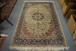 A good Persian rug, cream ground with floral decoration, 222cm x 140cm.