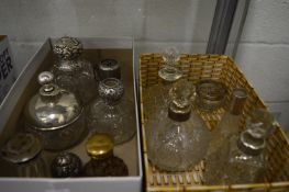 A group of cut glass and silver mounted scent bottles etc.