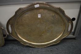 A large oval plated twin handled tray with engraved decoration.