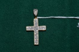 A good 9ct gold and diamond set crucifix pendant.