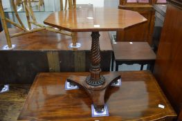 A 19th century mahogany octagonal shaped occasional table on writhen turned column with concave